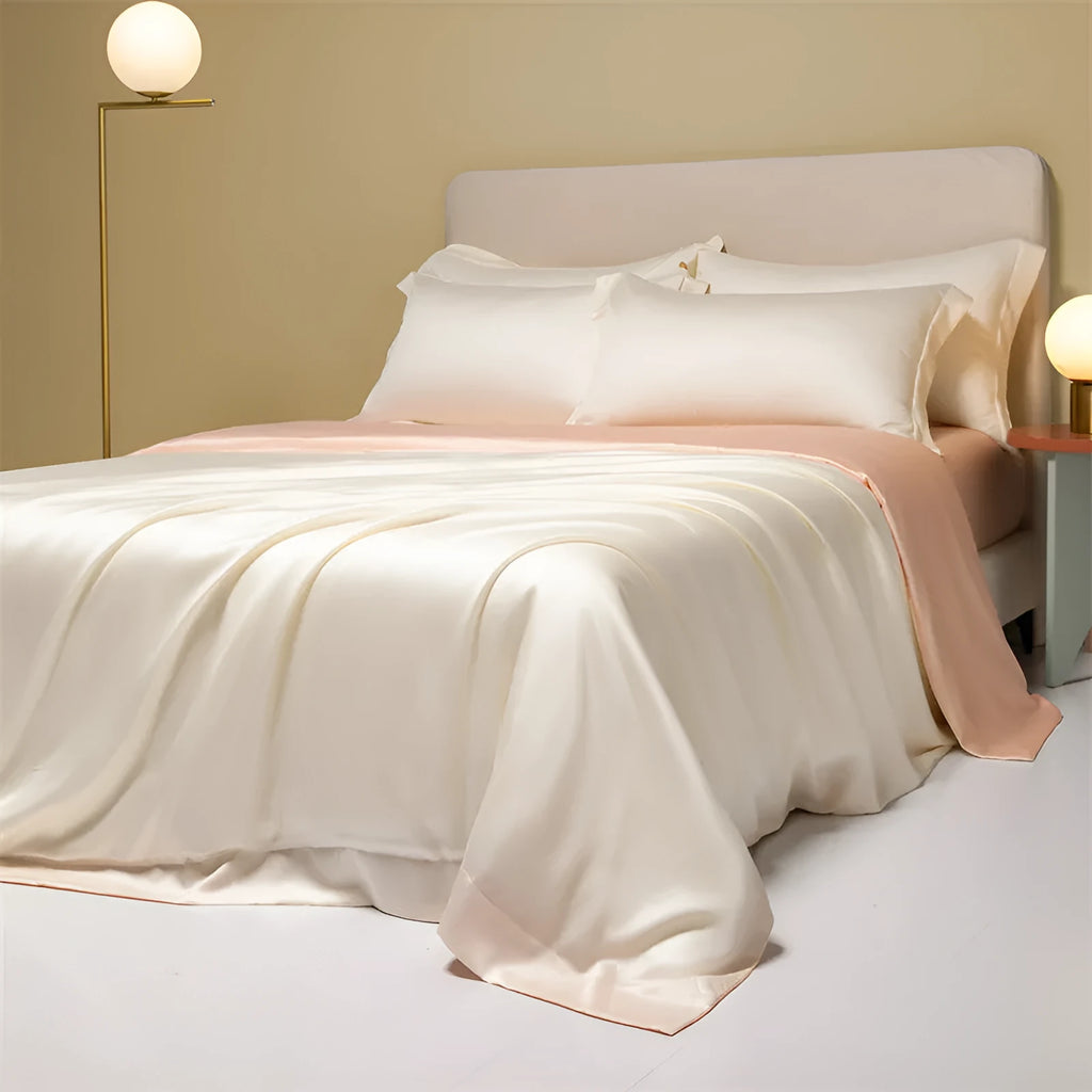 Lenzing Tencel quilt cover and pillowcase set in Aurora Blue, neatly arranged on a bed.