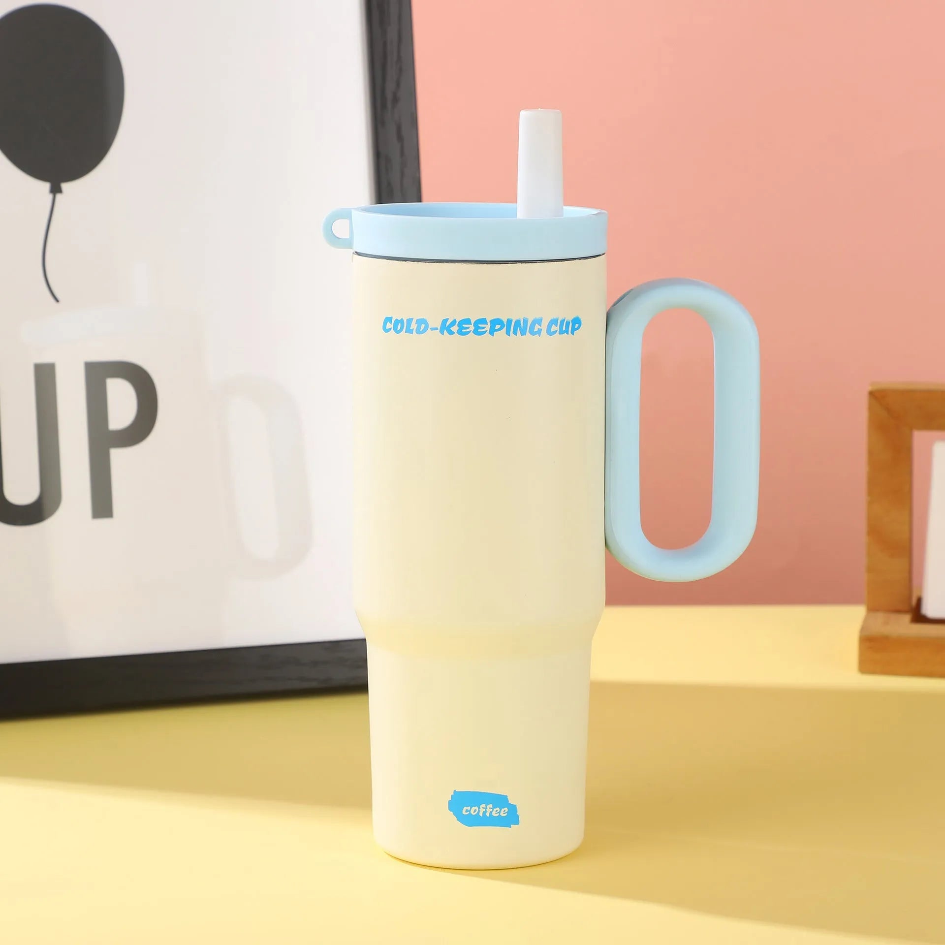 Large insulated plastic straw cup with a carry handle in a choice of five colours.