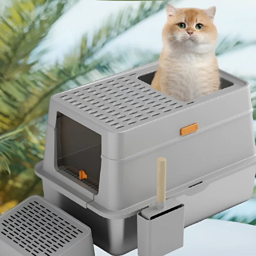 Grey enclosed cat litter box with foot pedal for hands-free opening.
