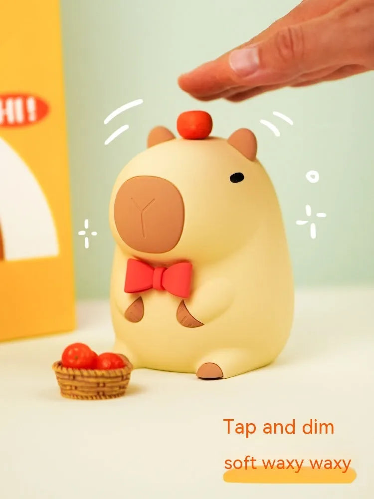 Capybara-shaped silicone night lamp with USB charging port and compact dimensions