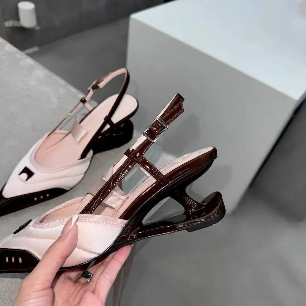 Women's black lace-up high heels with a special-shaped root design on a white background.