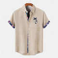 Loose fit linen short sleeve shirt with a colourful fish pattern print on the front.