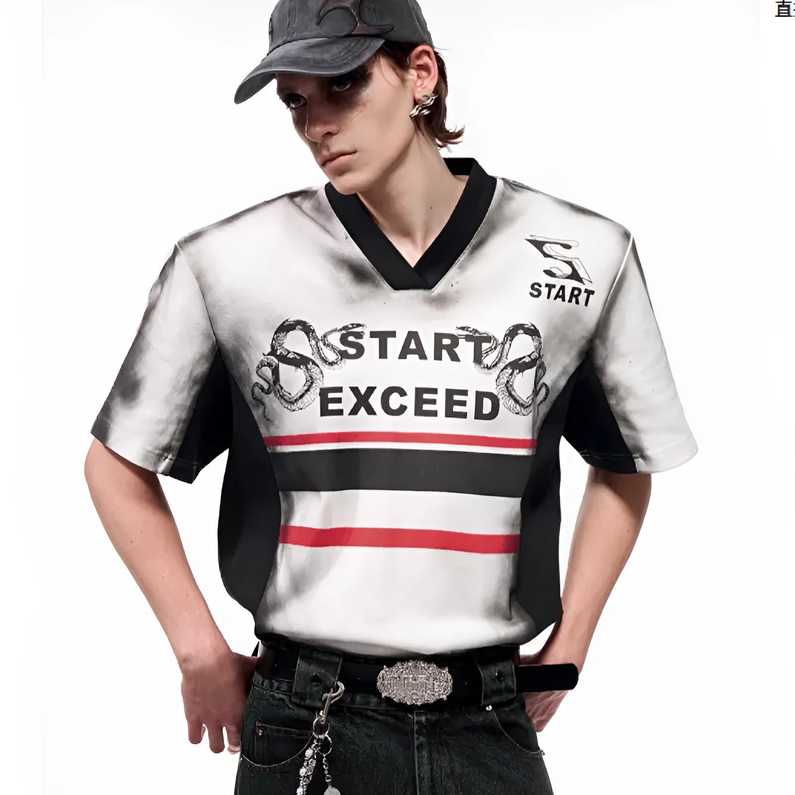 V-neck short sleeve top with snake letter pattern print and padded shoulders.