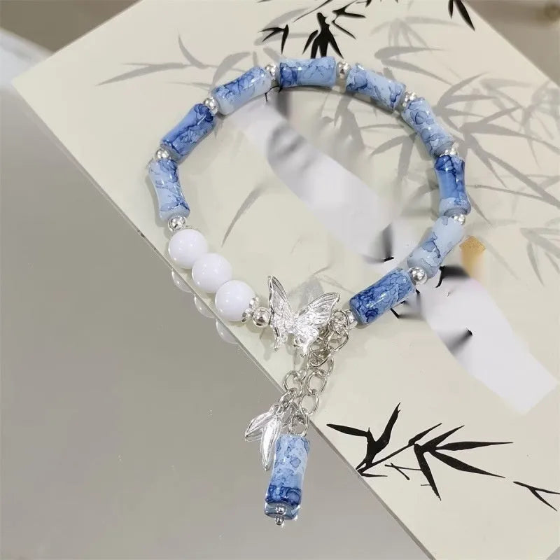 Chinese style glass bracelet with bamboo joint design elements in multiple colour options
