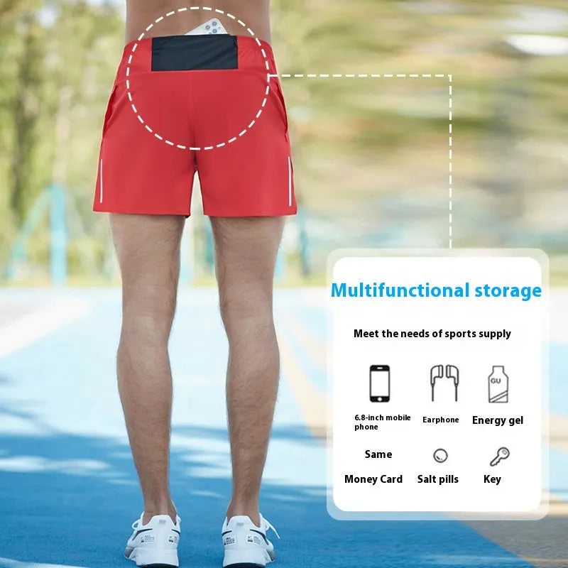 Men's loose-fit off-road running shorts in grey, showing high-waist design and built-in lining.