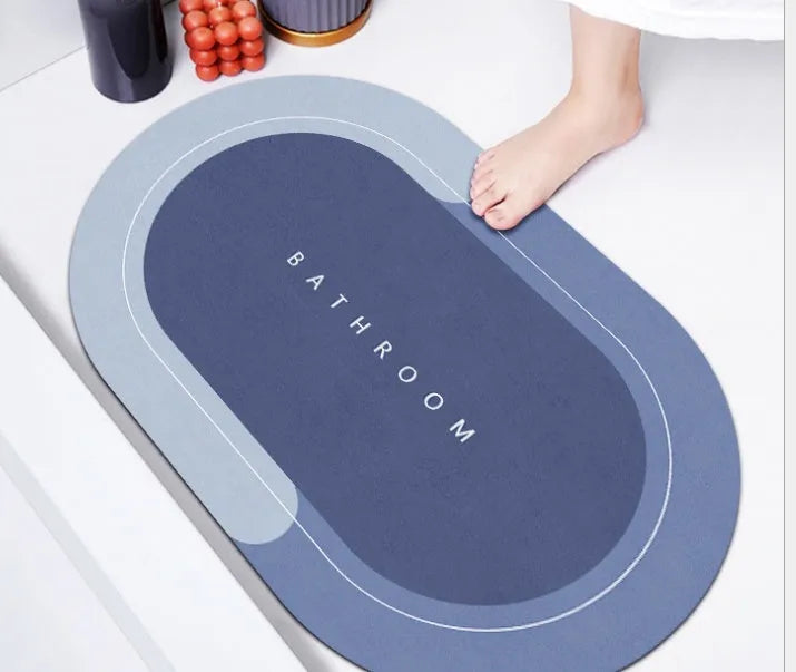 Diatom mud absorbent bathroom floor mat in blue rectangular shape on tiled floor