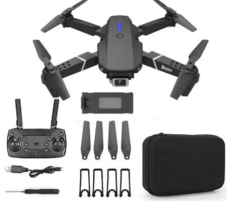 Grey foldable 4K dual camera drone with remote control, spare blades, and charging cable on a neutral background.