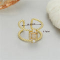 Adjustable open ring with 14K copper-plated gold finish and asymmetric U-shape design