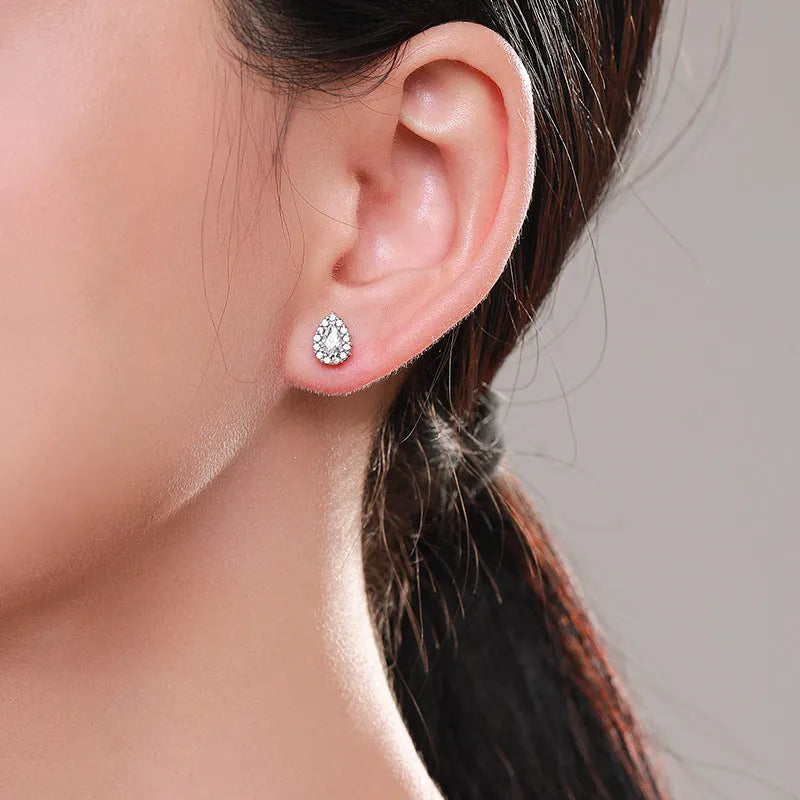 A pair of silver water drop shaped ear studs made from 925 sterling silver.