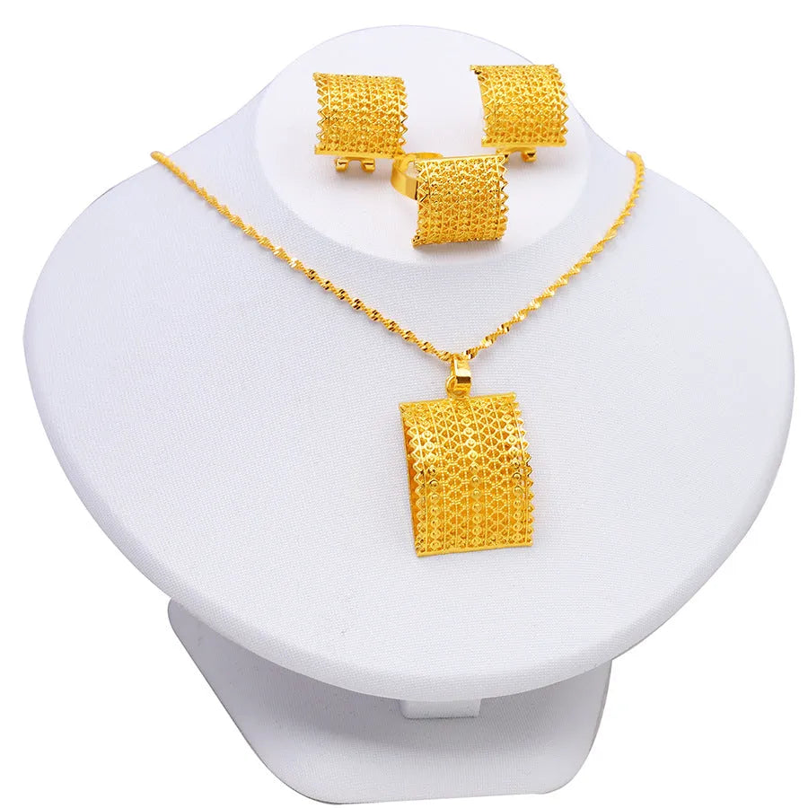 Golden copper bridal jewellery set showing matching necklace, earrings and ring for wedding occasions