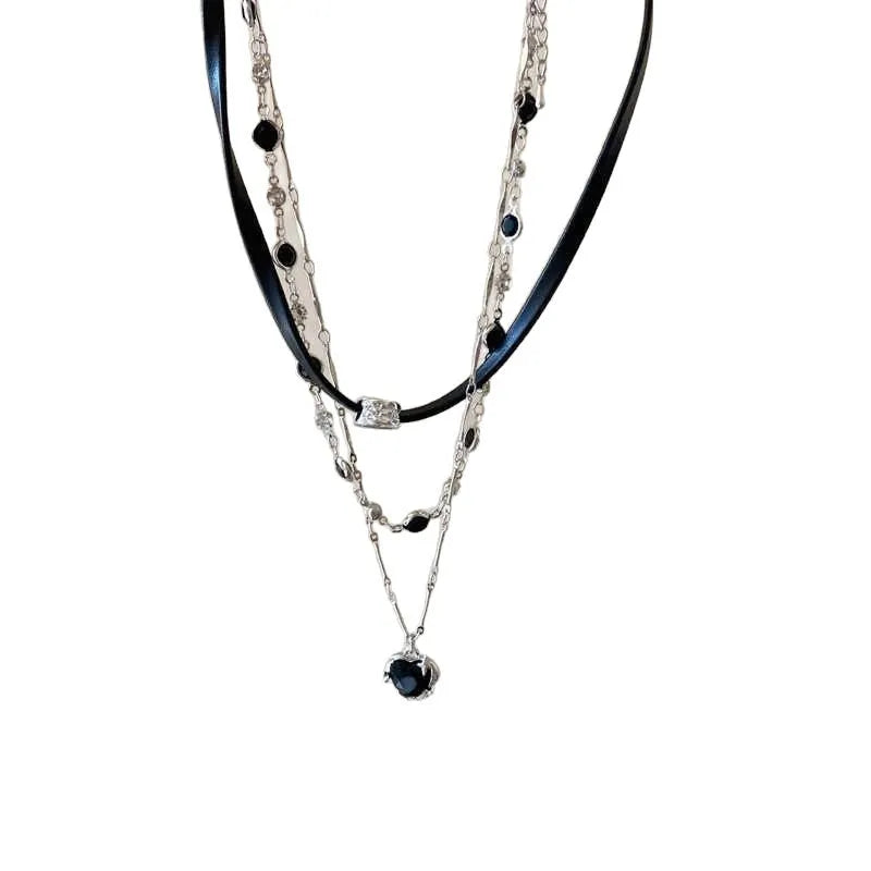 Women's creative multi-layer twin necklace set with alloy heart pendant, artificial crystal, and leather on an adjustable chain.