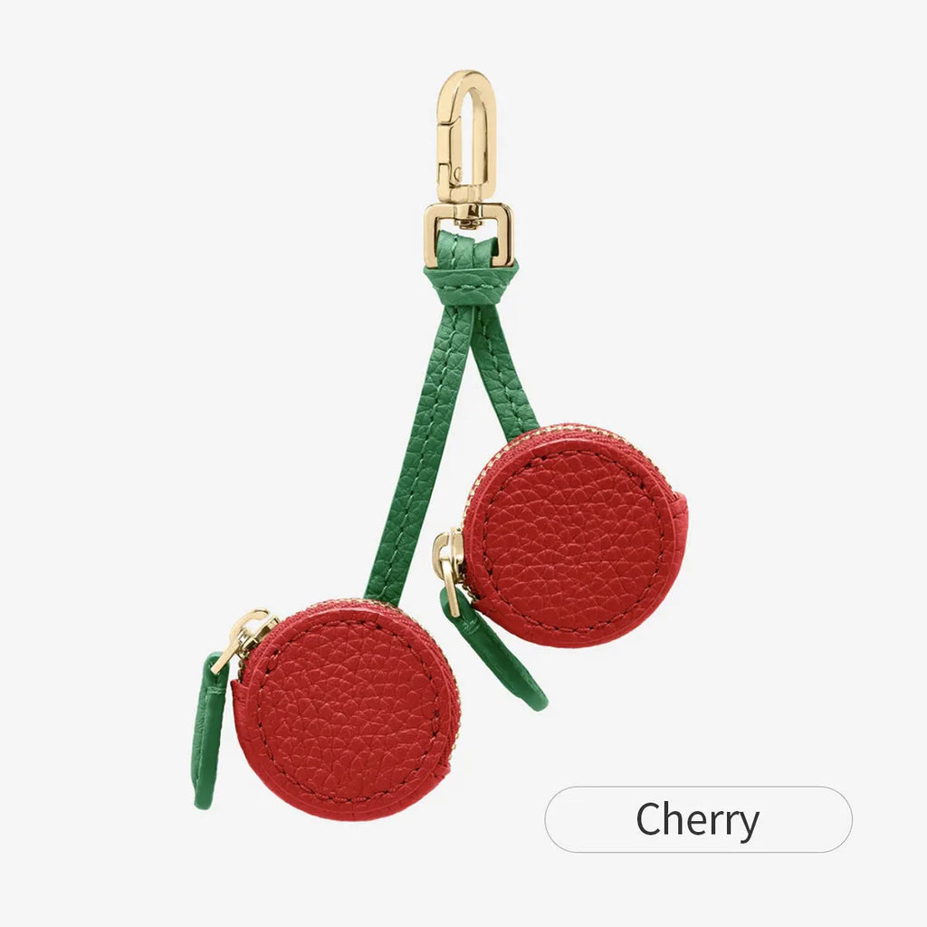 Small leather-look keychain coin purse in cherry red colour with a fresh fruit design.