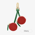 Small leather-look keychain coin purse in cherry red colour with a fresh fruit design.