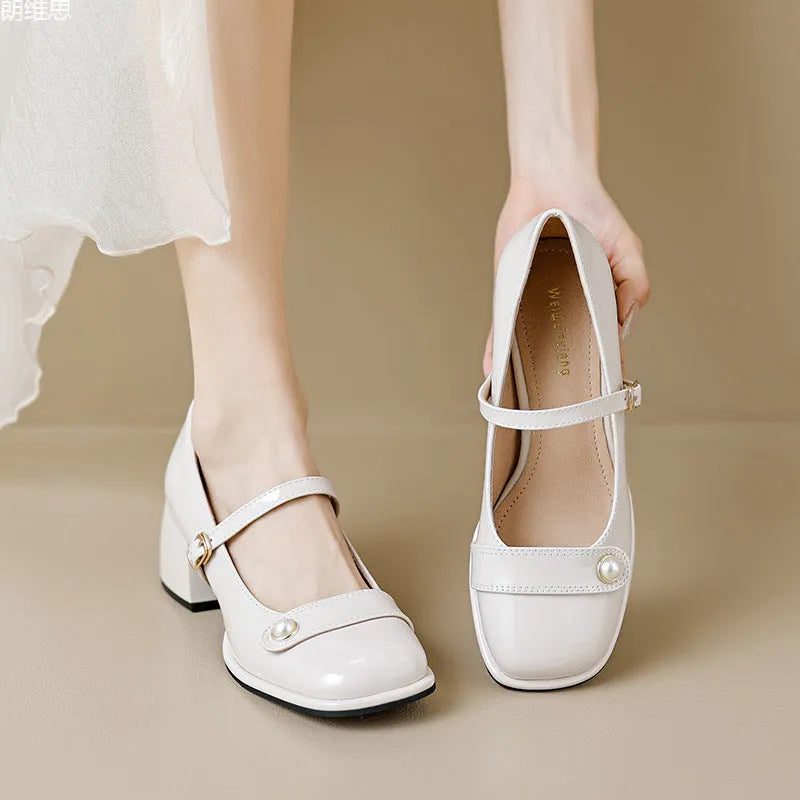 Women's apricot patent leather chunky heel ankle boots with a square toe and ankle buckle.
