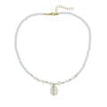 White conch-shaped mother pearl shell pendant necklace on a regular chain for women.
