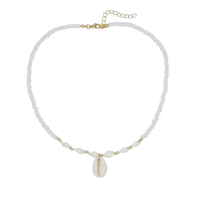 White conch-shaped mother pearl shell pendant necklace on a regular chain for women.
