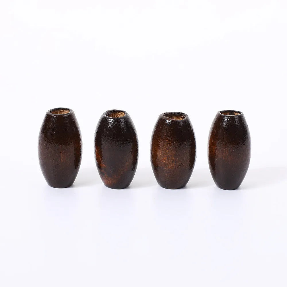 Oval M-shaped wooden bead in dark coffee colour, 25mm diameter with raised texture.