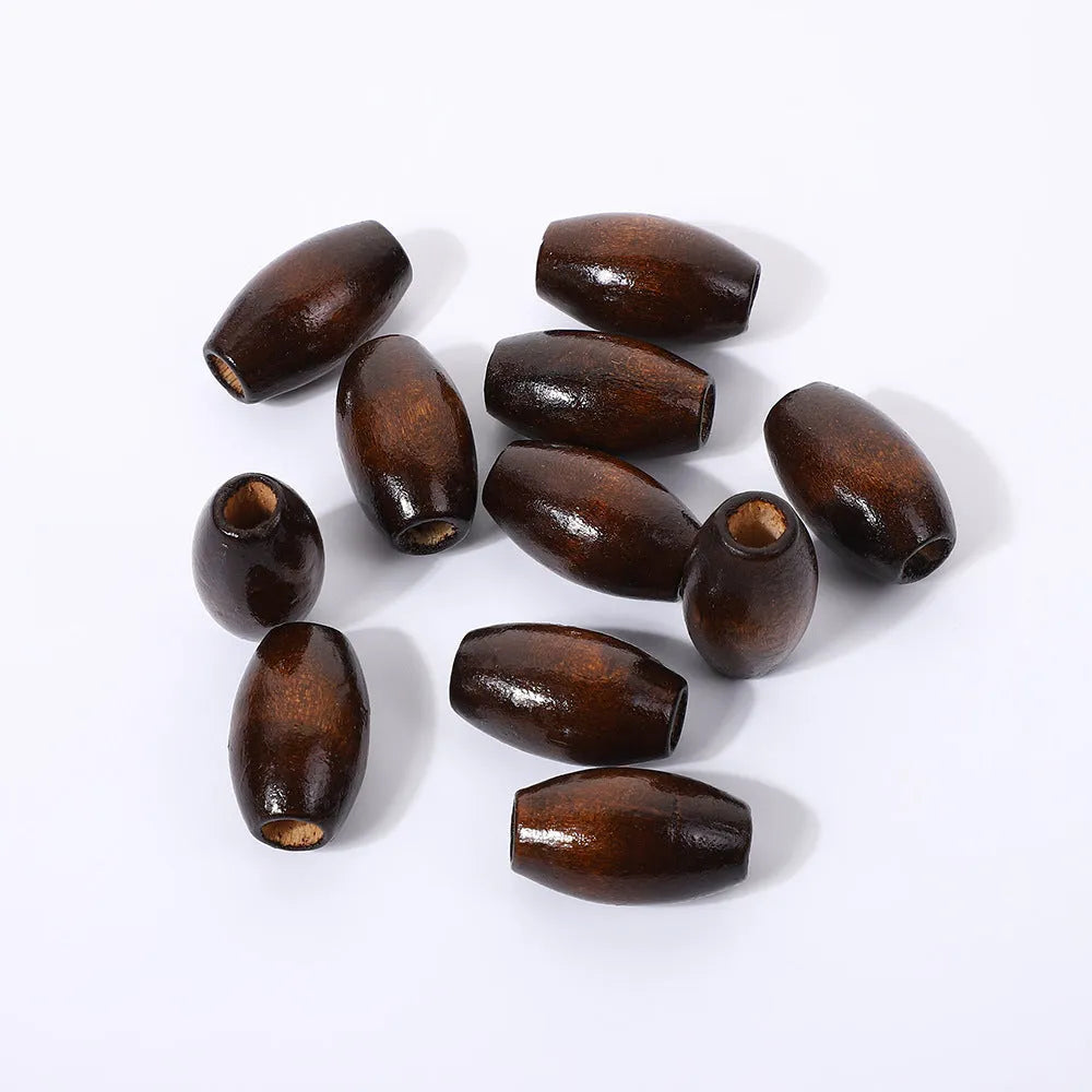 Oval M-shaped wooden bead in dark coffee colour, 25mm diameter with raised texture.