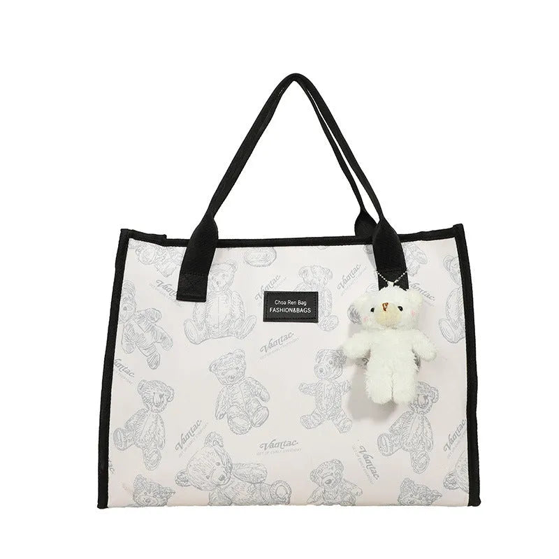Women's black canvas tote bag with rhombus pattern and horizontal square design