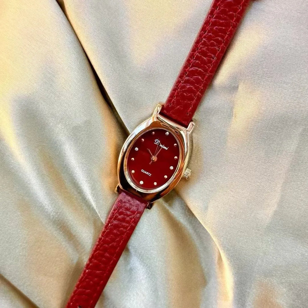 A Chinese-style alloy women's watch with various dial designs like camellia and octagonal diamond on an 8mm thick case.