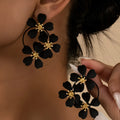 Retro floral earrings for women in black or white with iron construction