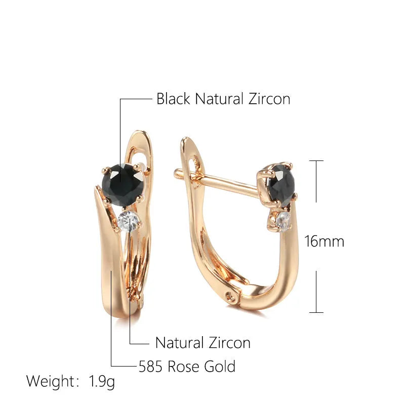Gold geometric drop earrings with black agate stone accents on copper base