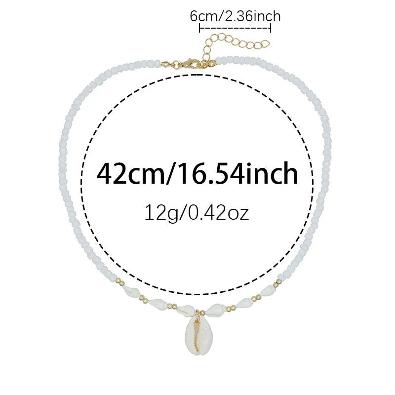 White conch-shaped mother pearl shell pendant necklace on a regular chain for women.