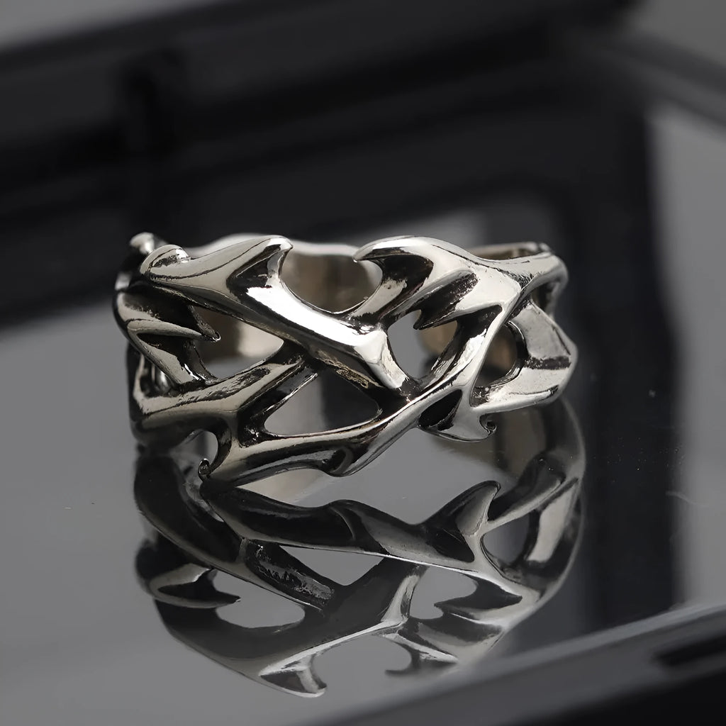 Copper men's ring with thorn flower design and adjustable geometric opening.