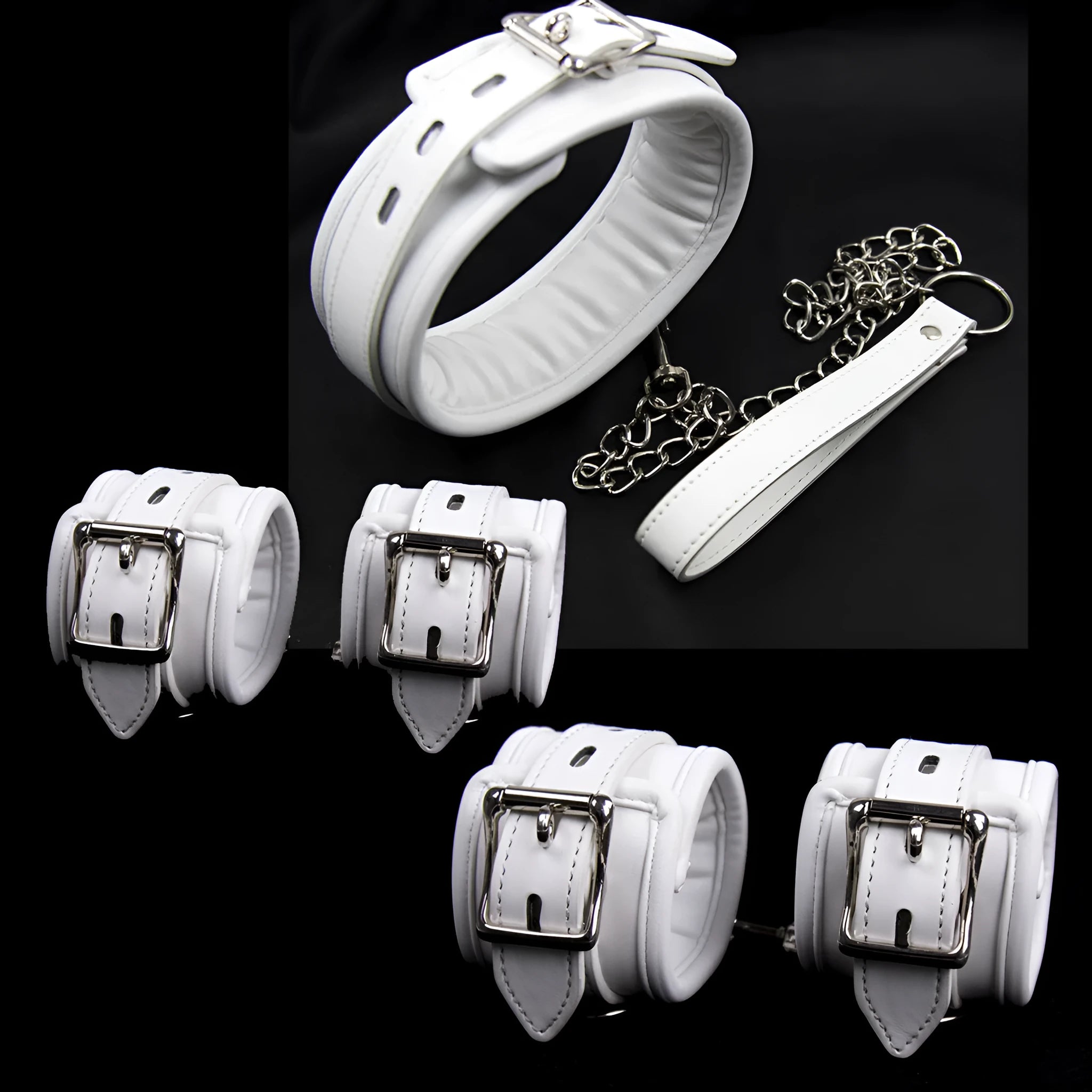 White PU sponge bondage handcuffs, foot cuffs, and neck scarf set on a plain background.