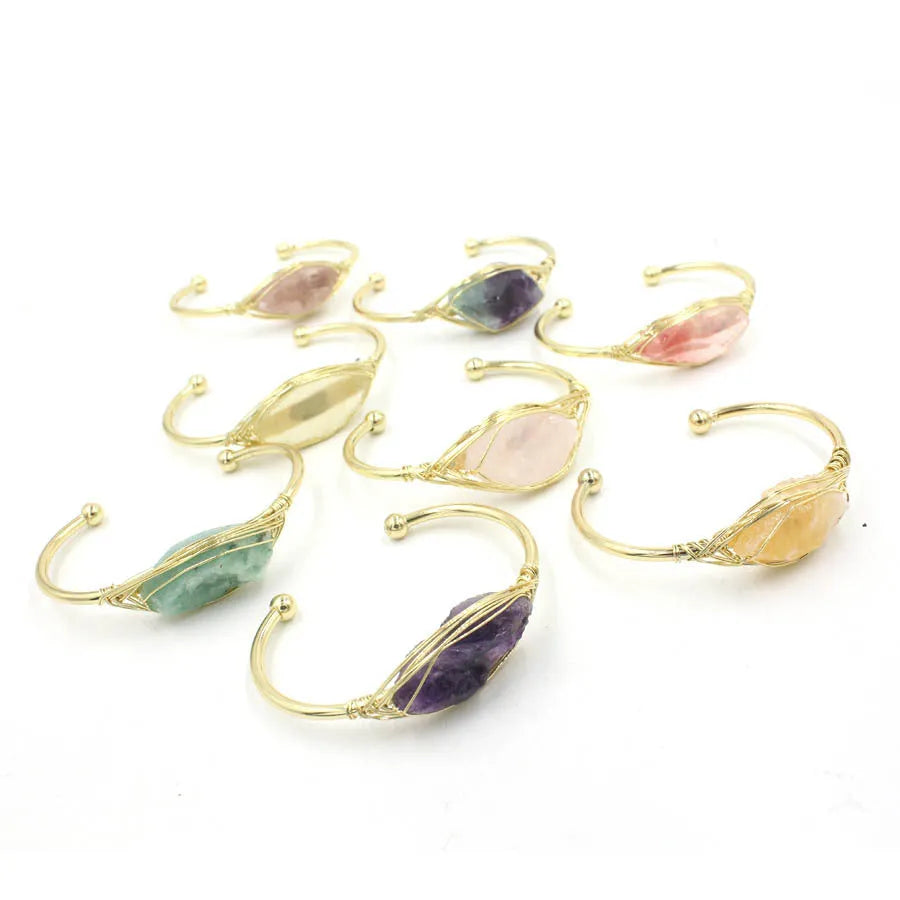 Natural raw gemstone bracelet with 8mm amorphous crystal beads on a white background.