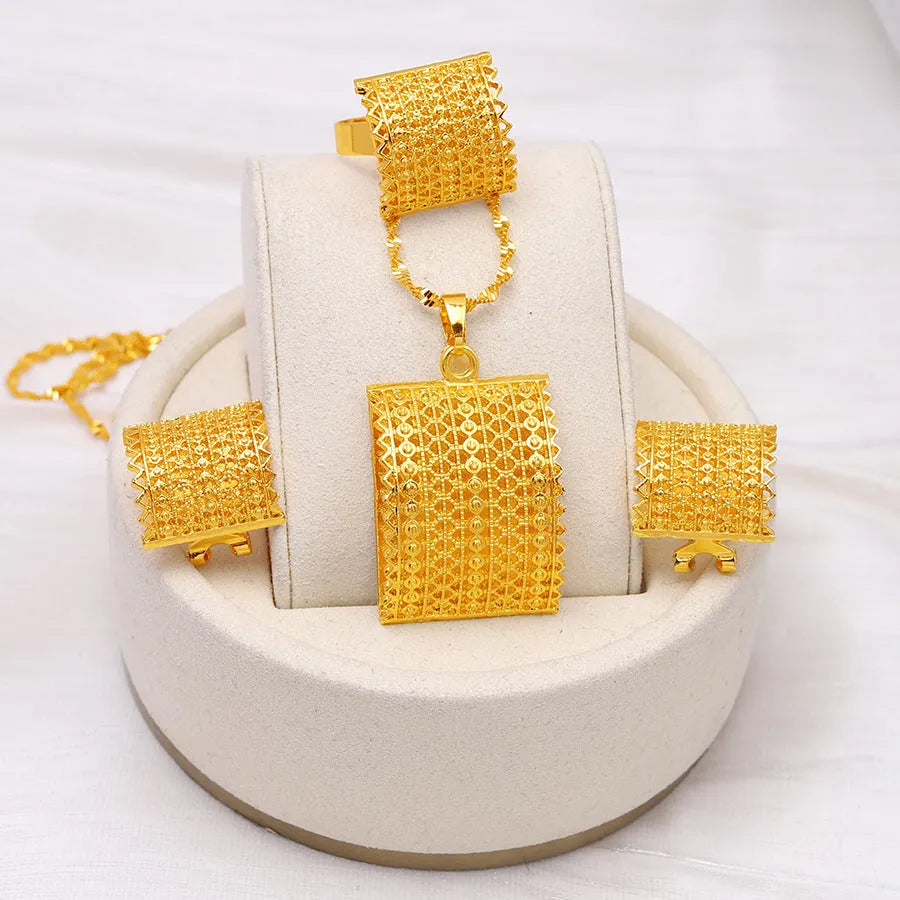 Golden copper bridal jewellery set showing matching necklace, earrings and ring for wedding occasions