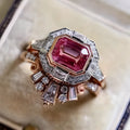 Retro style rose gold women's ring with a geometric shape and central ruby stone.
