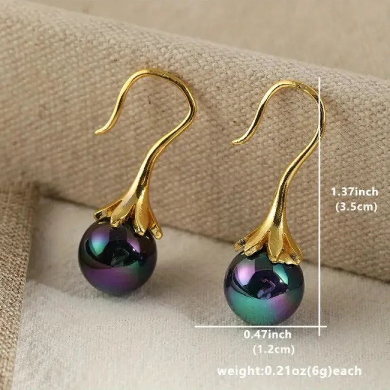 A pair of gold-colour retro-style women's earrings with an electroplated finish.