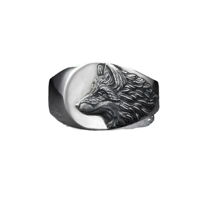 Men's silver geometric wolf head ring made from alloy on a grey background.