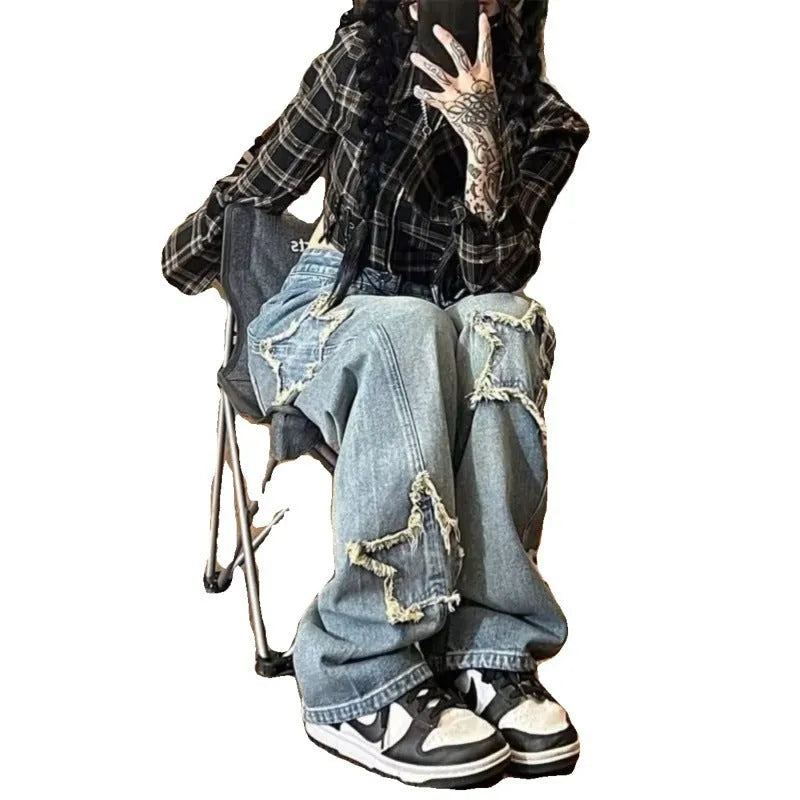 Blue women's straight-leg jeans with a high waist on a neutral background.