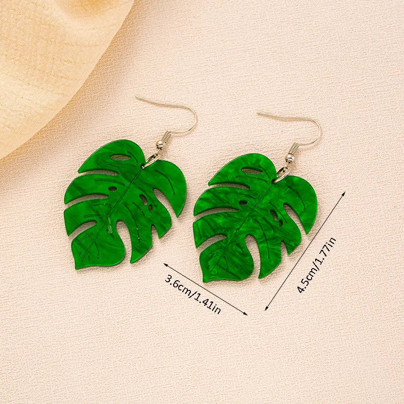 A pair of drop-shaped acrylic earrings designed like coconut leaves, in one of five colour variations.