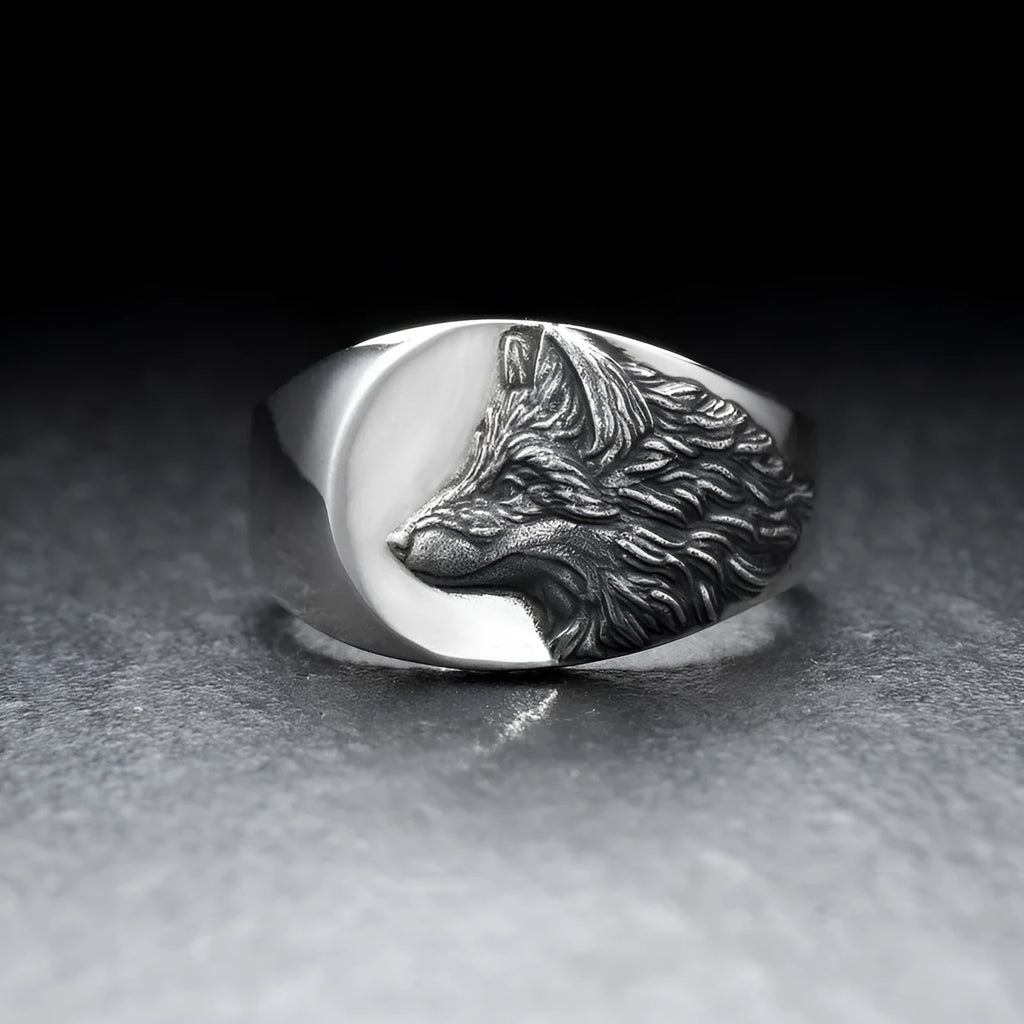 Men's silver geometric wolf head ring made from alloy on a grey background.