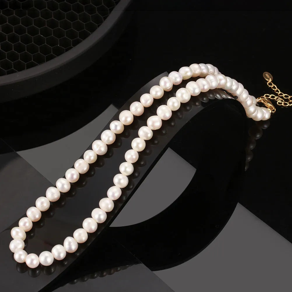 Close-up of a women's adjustable sterling silver necklace with a 6-7mm natural freshwater pearl pendant.