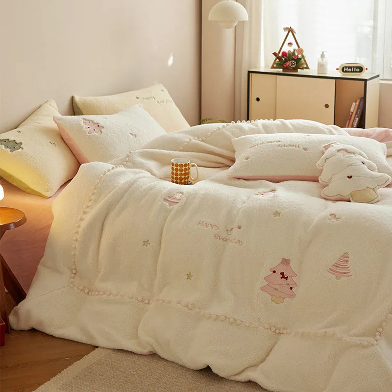Milk fibre bedding four-piece set with green Christmas tree pattern on a bed.