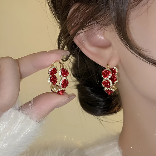 Red floral alloy clip earrings with rose design for women