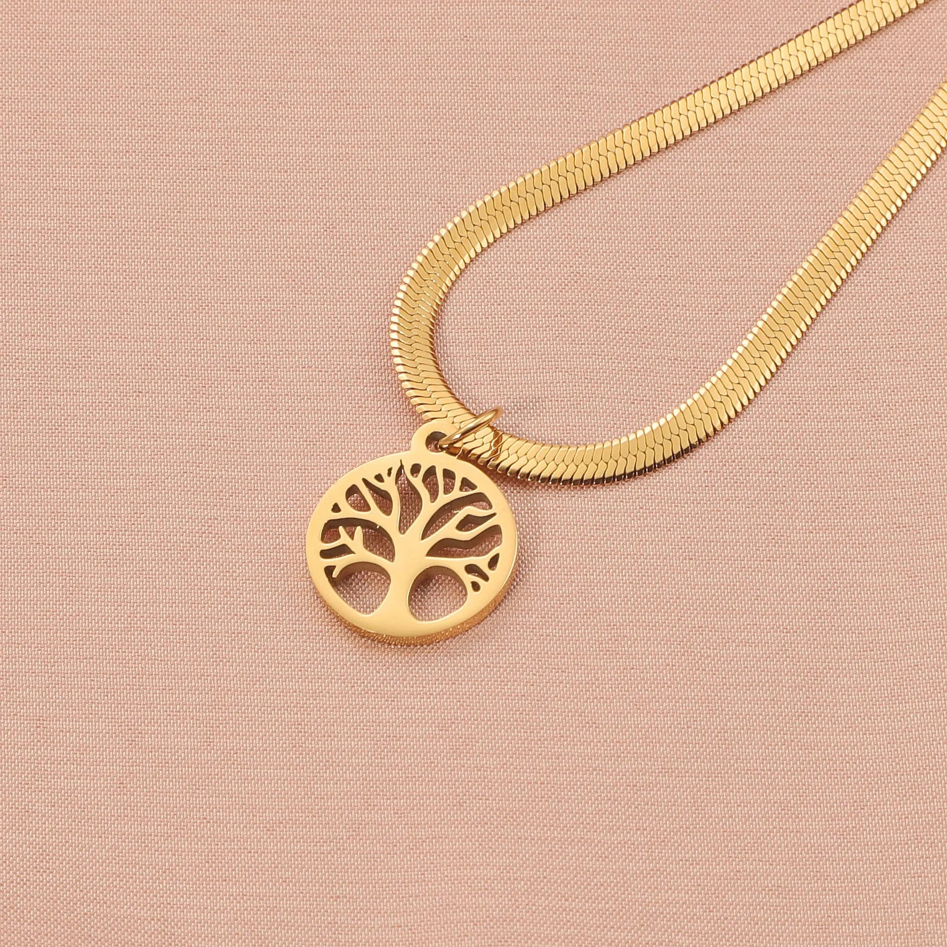 Gold or steel colour stainless steel necklace with a tree pendant on a snake bone chain.