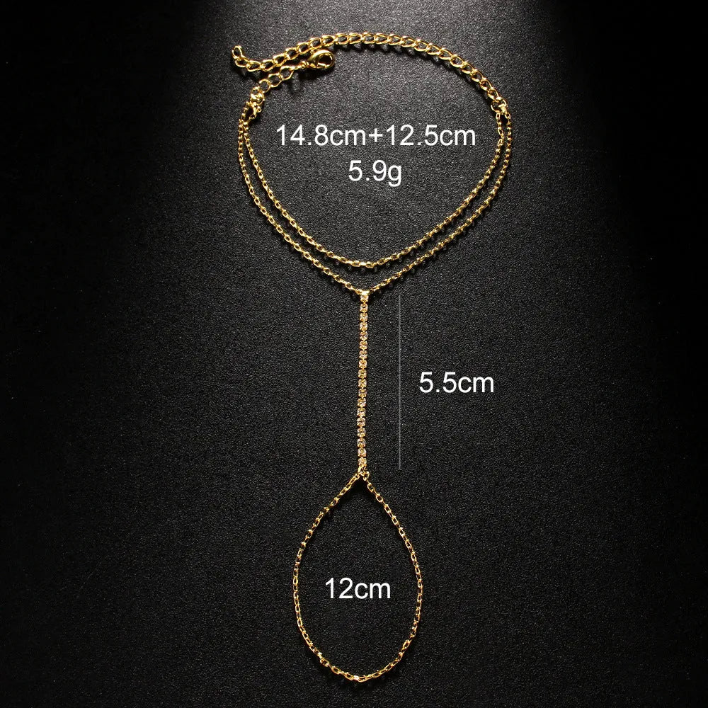 Women's geometric-shaped rhinestone bracelet in silver or gold colour on a wrist.
