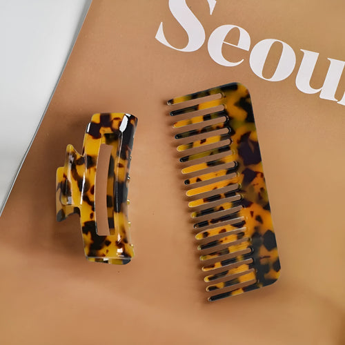 Acetic acid hair comb with wide teeth and matching holding clip in beige grain finish