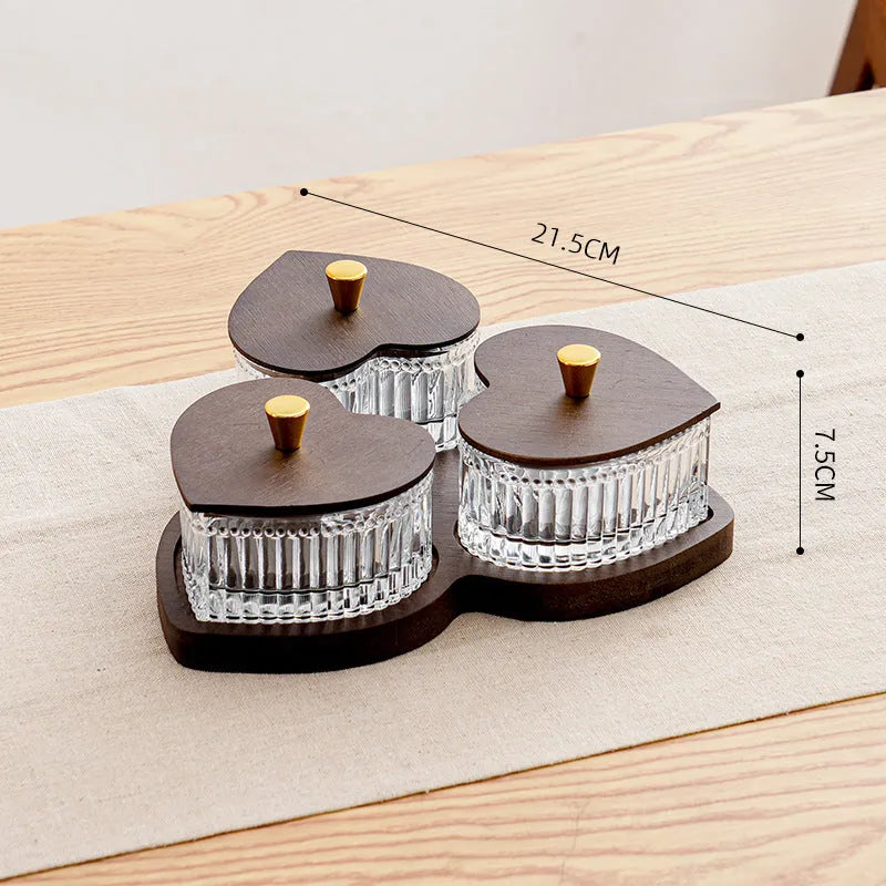 Glass snack plate with heart-shaped lids on a multi-grid tray in a retro style.