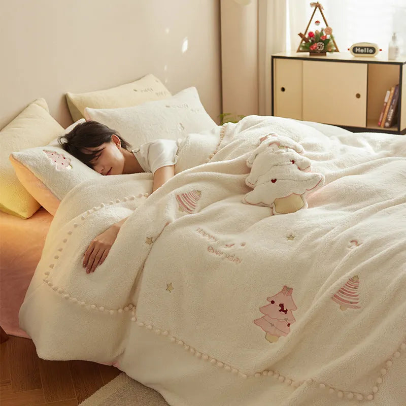 Milk fibre bedding four-piece set with green Christmas tree pattern on a bed.