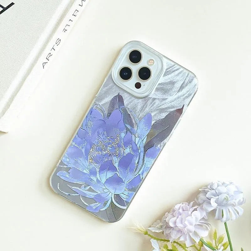Blue Lotus light luxury hard PC phone case for Apple iPhone on a table.