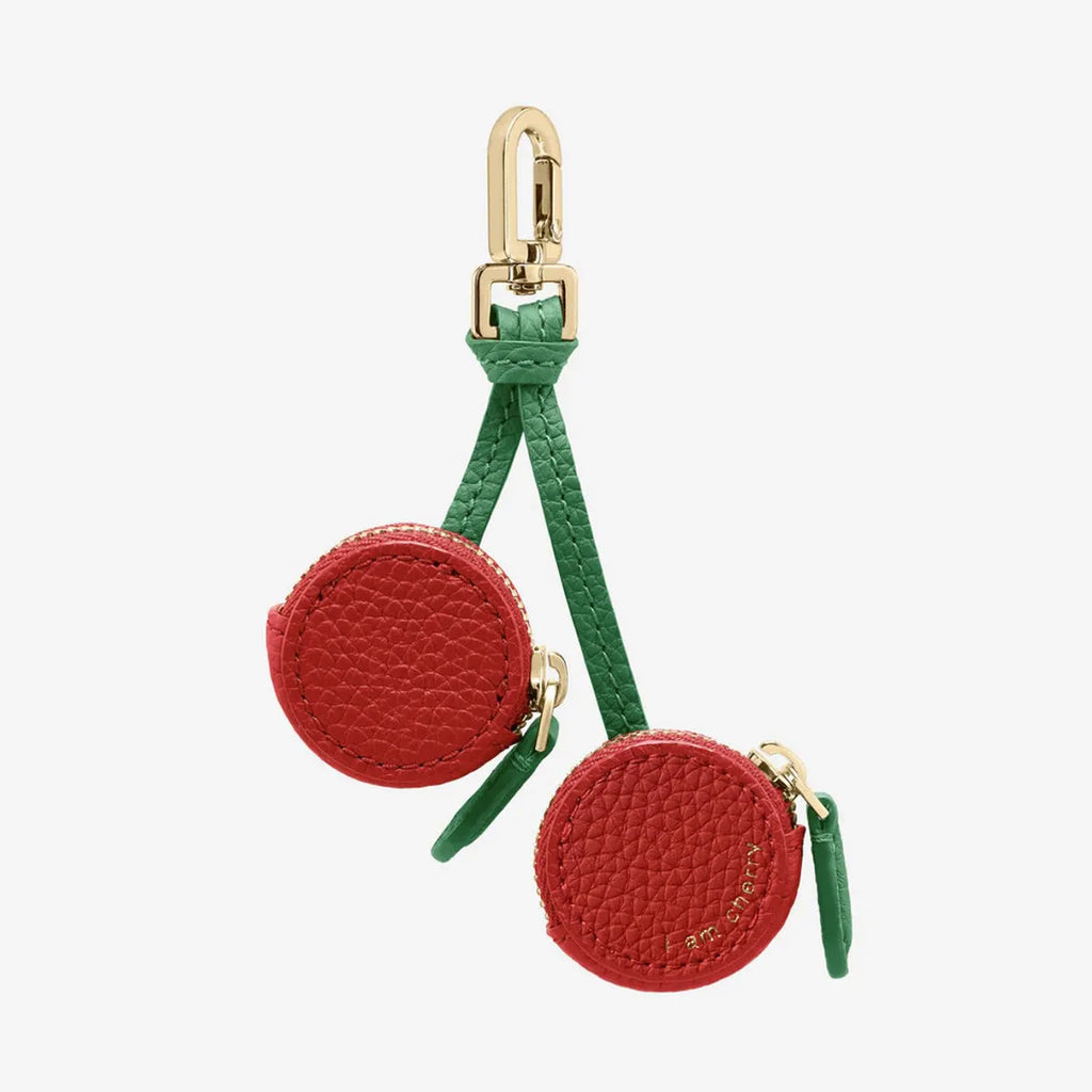 Small leather-look keychain coin purse in cherry red colour with a fresh fruit design.
