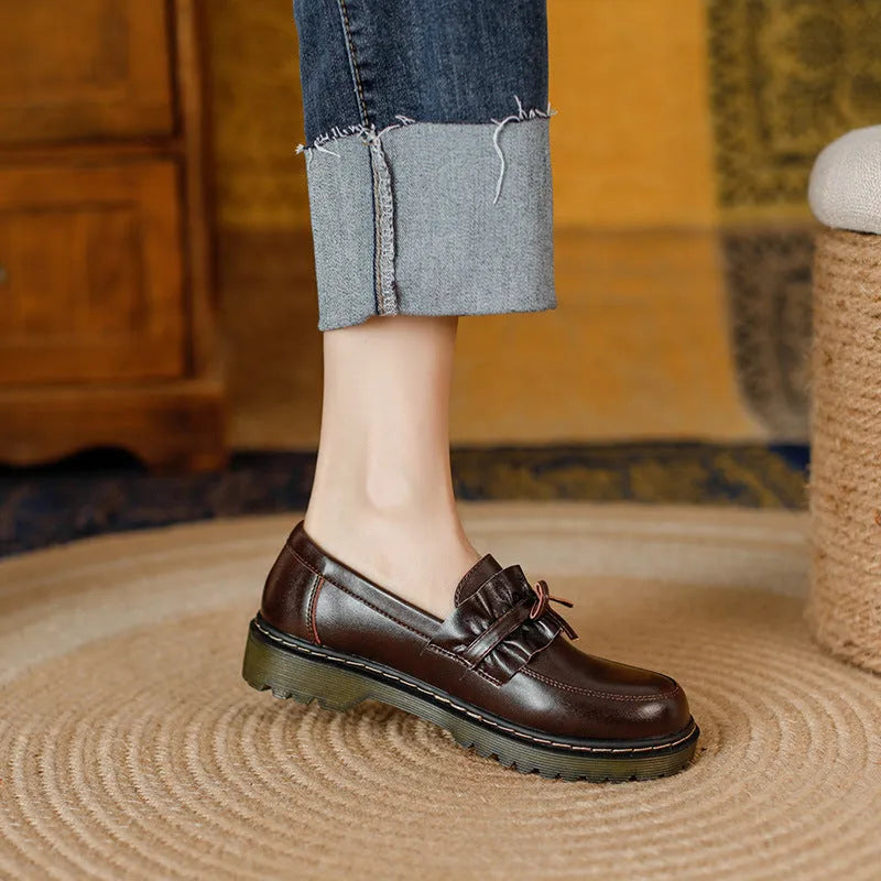 Women's black leather shoes with round toe and chunky flat heel, British style low-top design.
