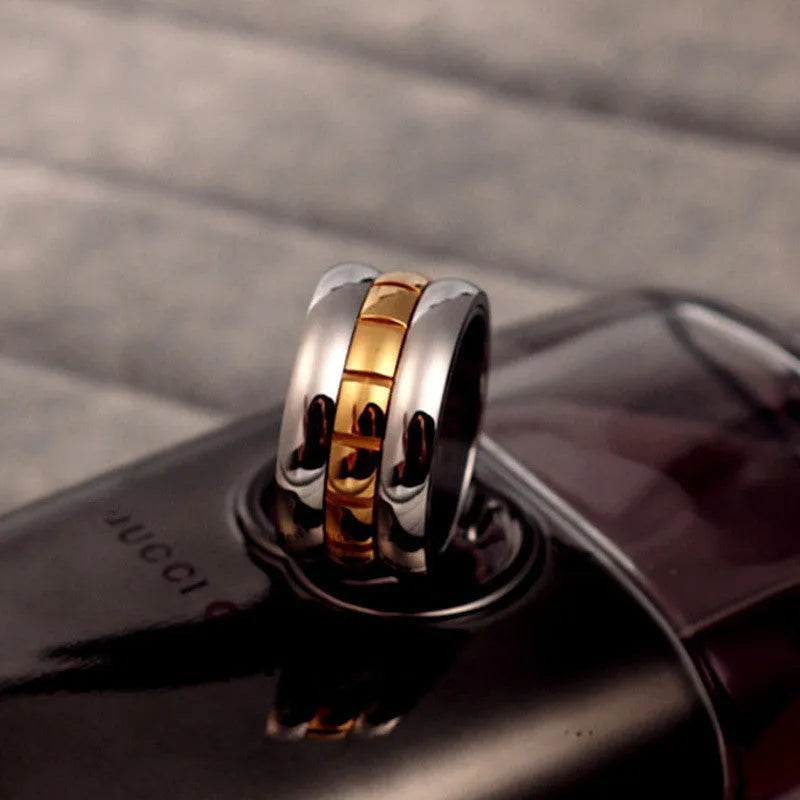 Ultra-wide titanium steel knuckle tail ring in gold colour with rotatable design