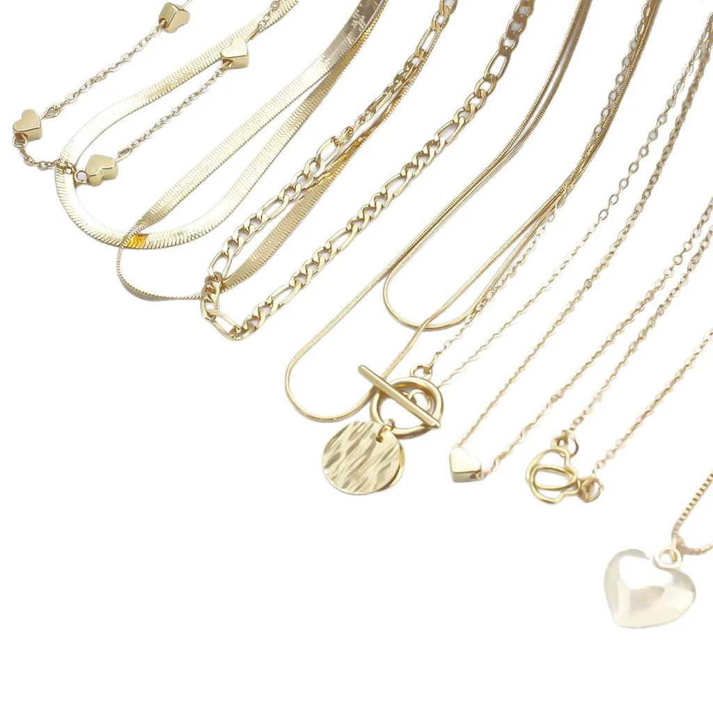 Set of ten simple gold women's necklaces with alloy pendants on snake bone chains.